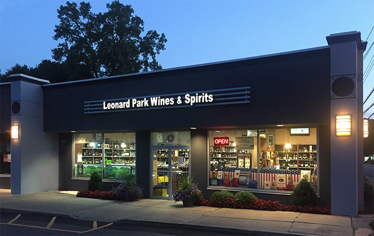 Exterior storefront of Leonard Park Wines at dusk